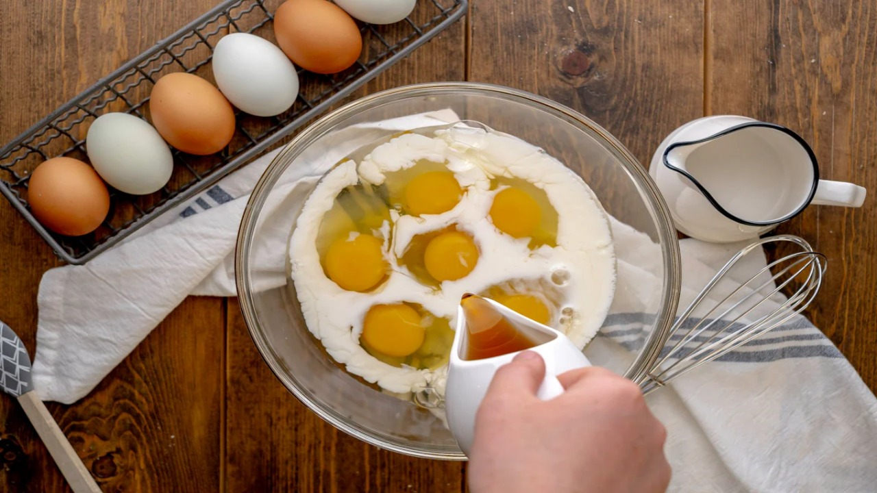 Adding Eggs And Vanilla Extract