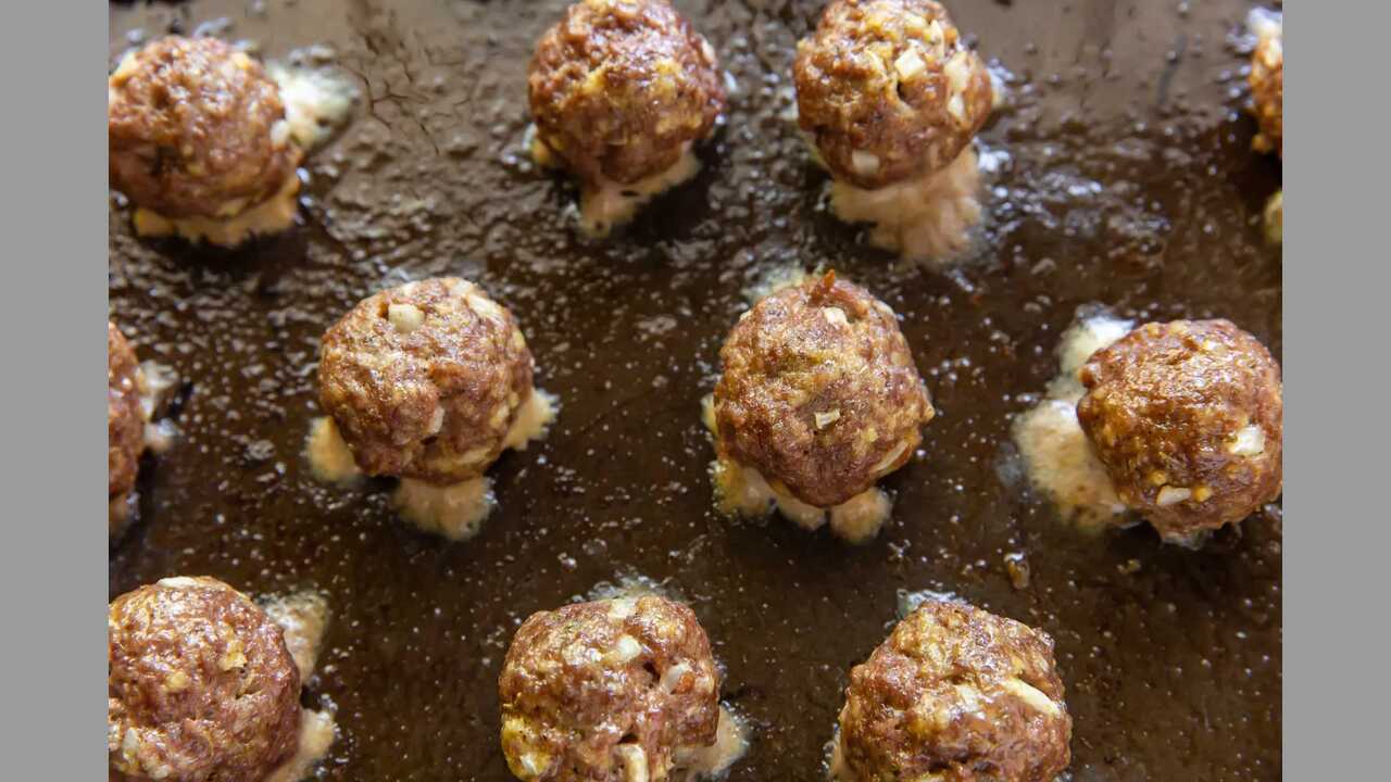 Baking The Meatballs Until They Are Cooked Through And Golden Brown