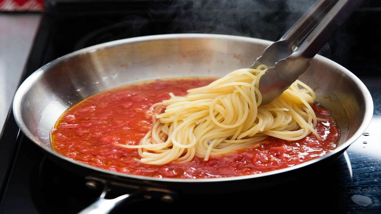 Combine Pasta And Sauce In A Large Bowl