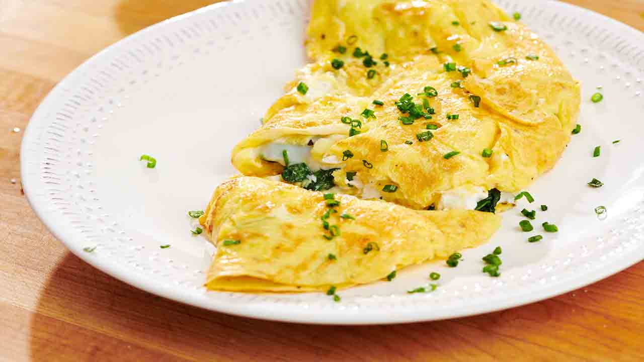 Eggsquisite Flavors: A Guide To Making Cheese And Spinach Omelet