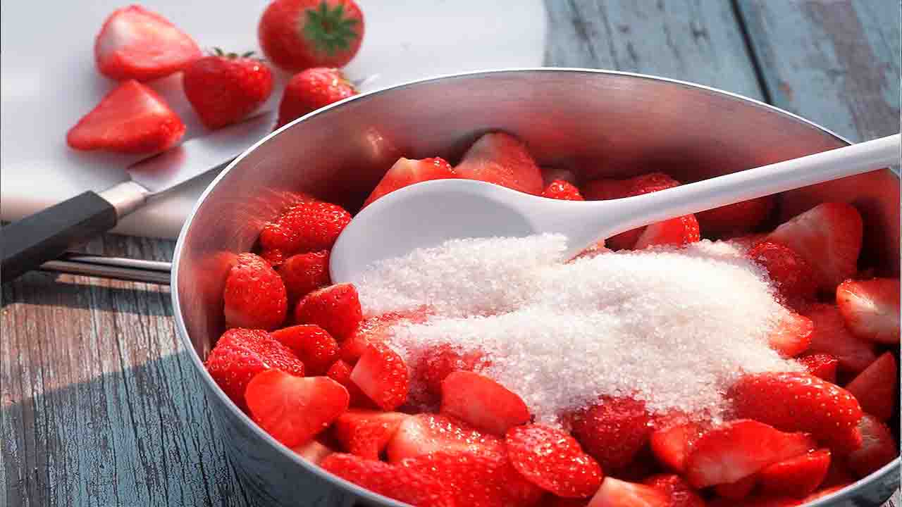 Stir The Strawberries And Sugar Together