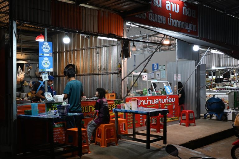 Street food stall with plastic stools