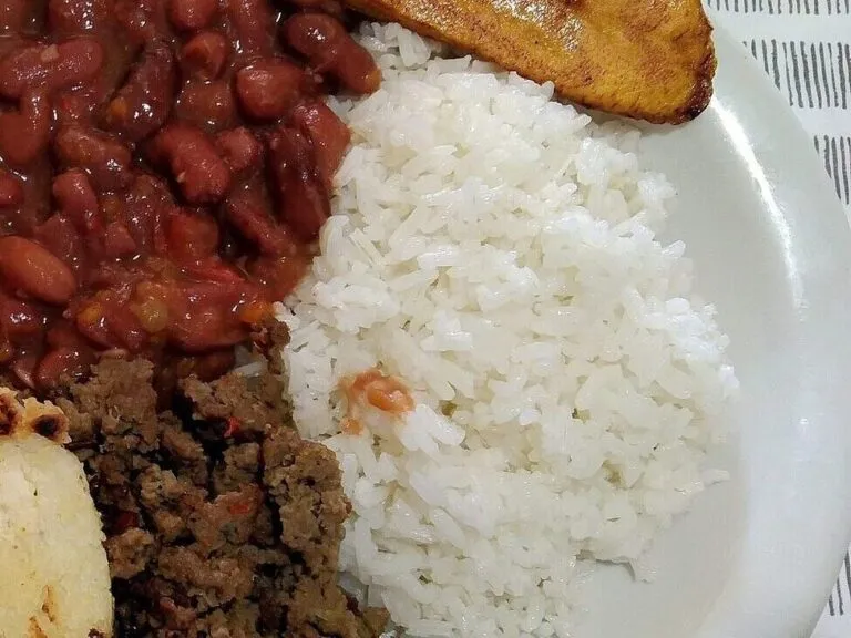 Bandeja paisa plate with red beans, rice, plantain, fried egg and minced beef