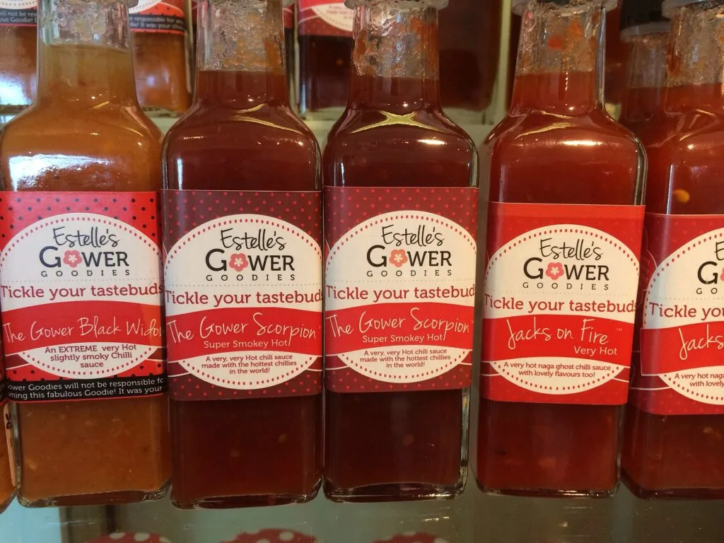 Shelf of hot sauce bottles