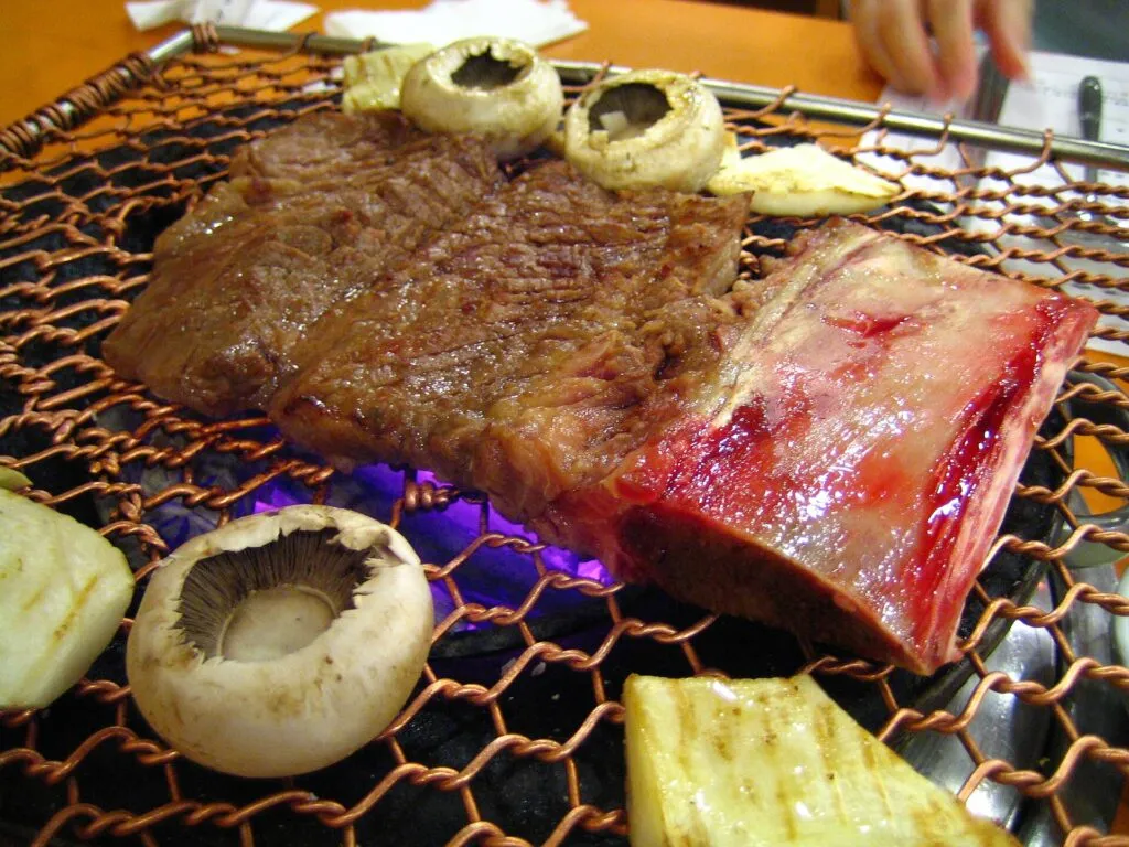 Beef galbi on a Korean barbecue grill