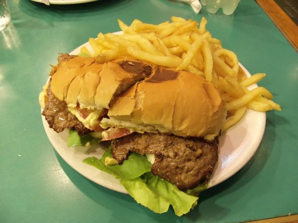 Uruguayan chivito steak sandwich with fries
